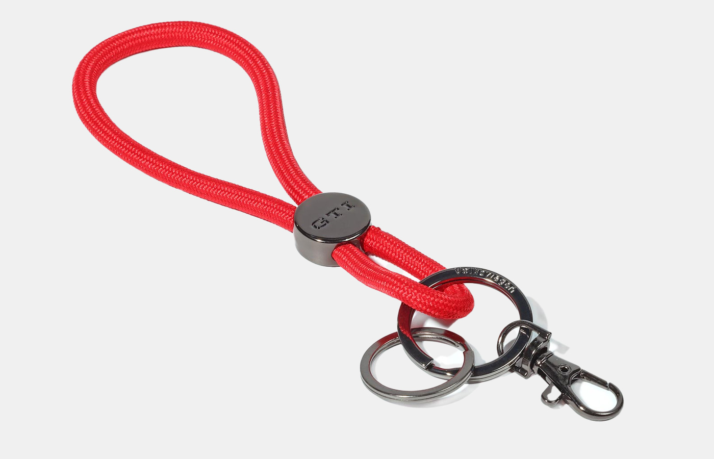 Key Tag, red cord with embossed GTI logo on the metal element